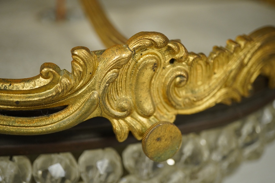An ormolu and glass drop bag chandelier. Condition - some drops missing/loose
